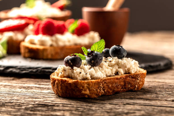 istock Fruit Bruschetta with cheese, fresh berries, Delicious breakfast or snack 1264403932