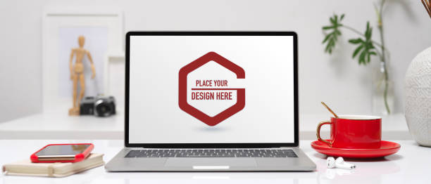 istock Office desk with mock up laptop, smartphone, diary book, coffee cup and decorations 1264404762
