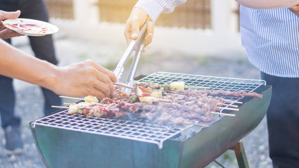 istock Hand-grilled barbecues on charcoal grills for a holiday celebration. 1264405520