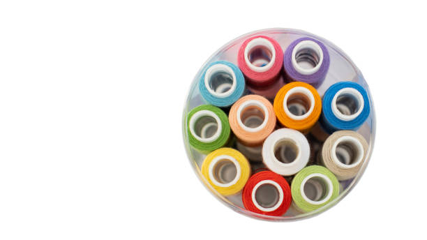 istock Top view of multi-colored threads in a tube on an isolated background, copy space. Needlework concept, handmade 1264406634
