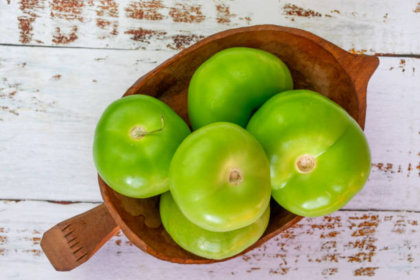 green tomatoes or tomatillo for Mexican sauce green tomatoes or tomatillo for Mexican sauce tomatillo photos stock pictures, royalty-free photos & images