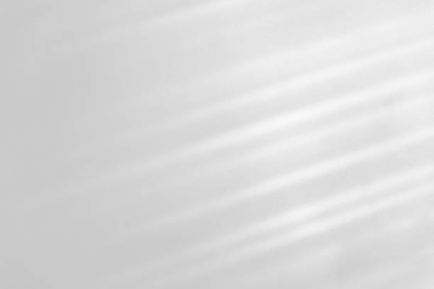 istock diagonal shadow and rays of light on a white background 1264408905