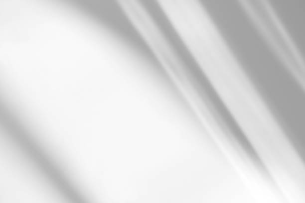 istock diagonal shadow and rays of light on a white background 1264408947