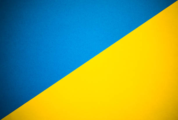 istock Diagonally divided yellow and blue abstract background 1264409137