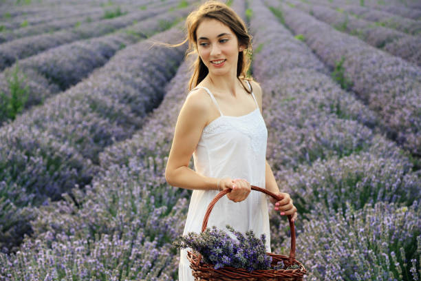 istock Young girl in lavender field 1264410341