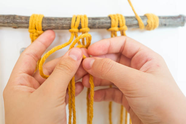 hands doing macrame craft - passion women human hand macro imagens e fotografias de stock