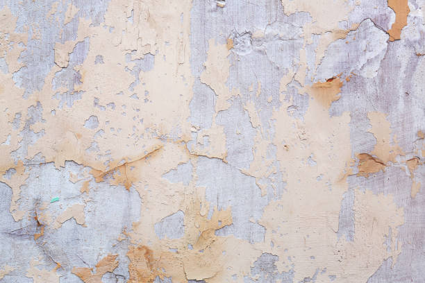 istock Concrete, weathered, worn, damaged wall paint. Rough, concrete surface with cracks and scratches. Great background or texture. 1264420999