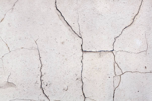 istock Abstract concrete, weathered with cracks and scratches. Landscape style. Great background or texture. 1264421008