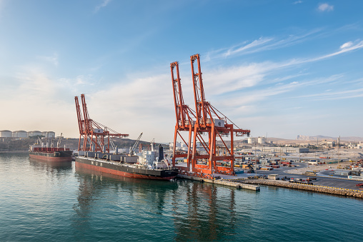 Salalah, Oman - November 19, 2019: Bulk Carrier vessels moored in Port of Salalah in Oman, Arabian Sea. Loading and unloading, export-import.