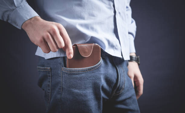istock Man putting wallet in his pocket. 1264421054