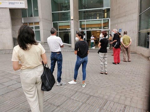 Las Palmas de Gran Canaria, August 7. Queue of people in front of a public health centre, in times of Covid