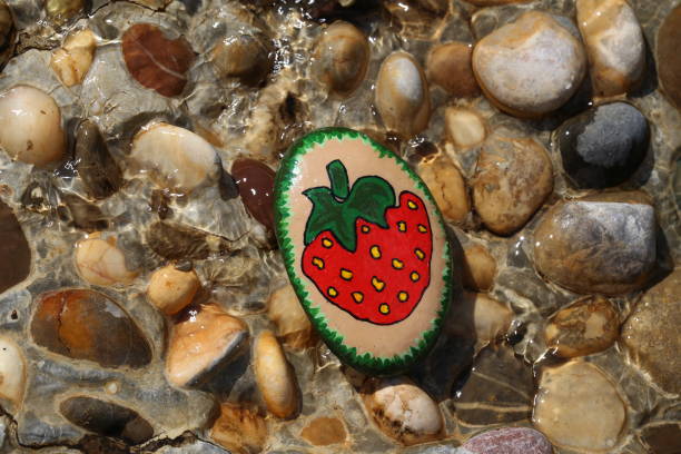 istock A painted hiking stone is left on the walking path for passersby to see 1264427285