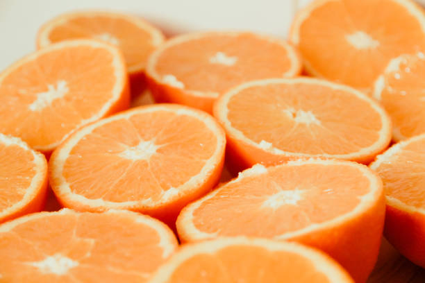 istock Bunch of fresh sliced oranges on a tray 1264427918