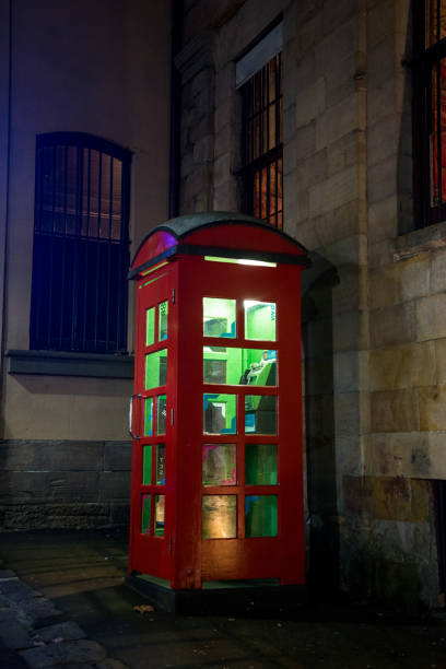 istock Red telephone box with green light 1264433031