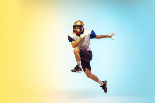 istock American football player isolated on gradient studio background in neon light 1264436170