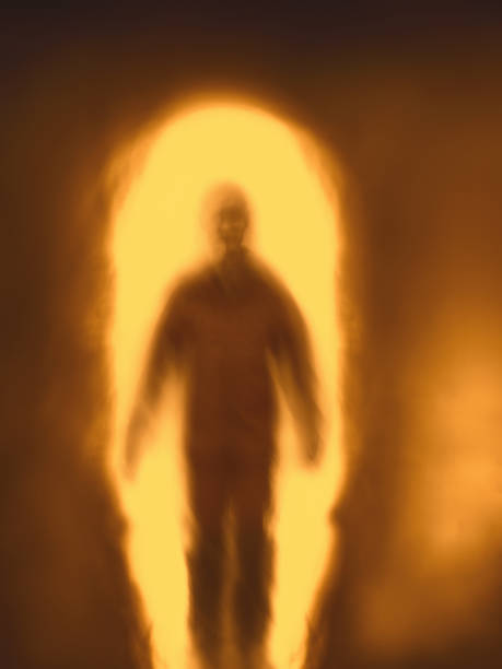 istock Blurred silhouette of man against fire portal 1264439321