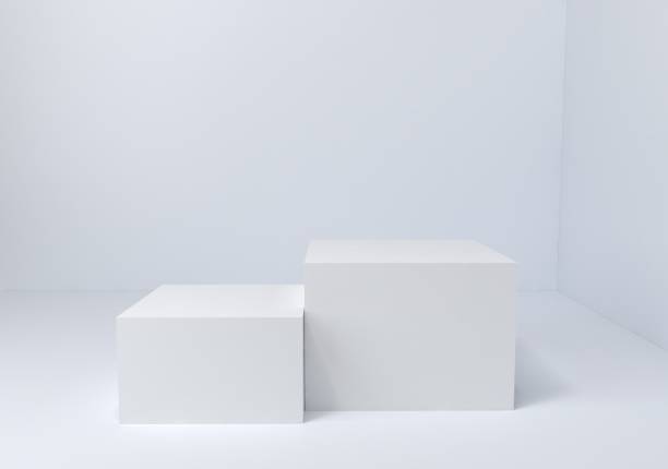 istock 3d render, two white podiums, platforms for products. Cube pillar stand scene, winner pedestal in studio on white background. 1264439489
