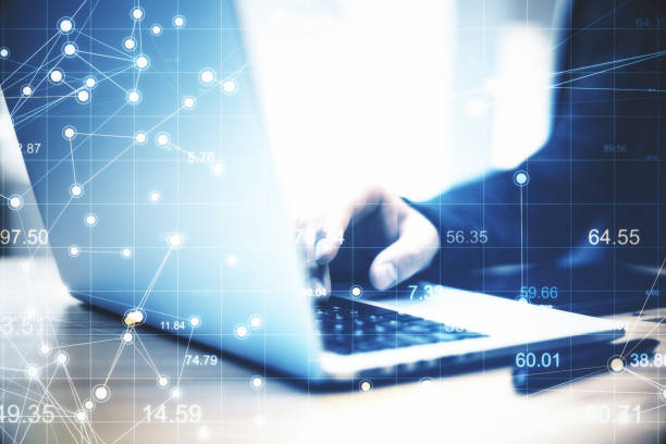 istock Hand using on laptop and digital scatter charts hologram. 1264440922