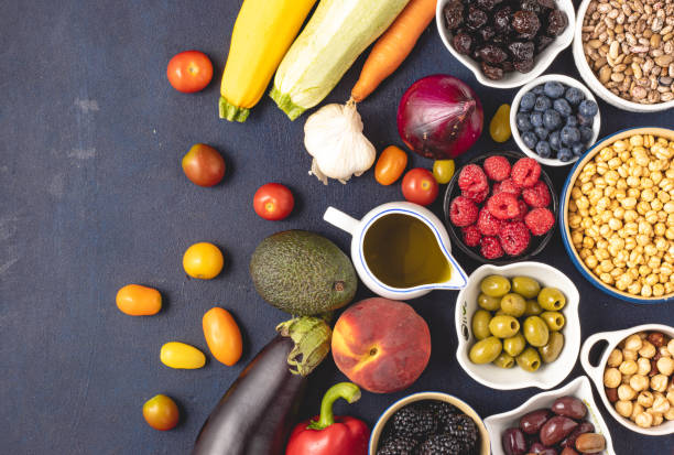 istock Top view of raw Mediterranean diet ingredients placed on dark background. 1264443688