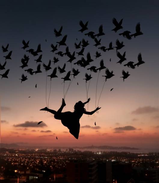 istock fly woman, birds 1264443837