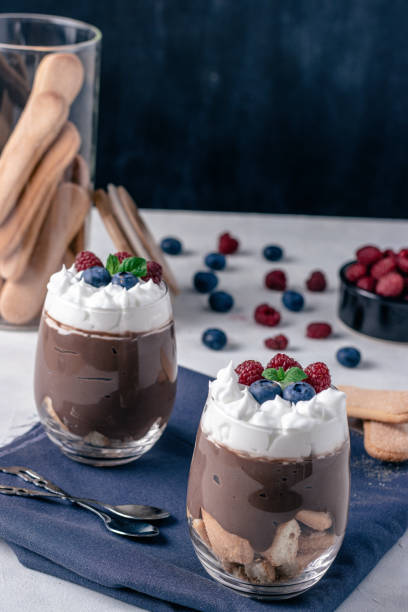 istock Chocolate pudding with ladyfinger biscuit and fruits. 1264444104