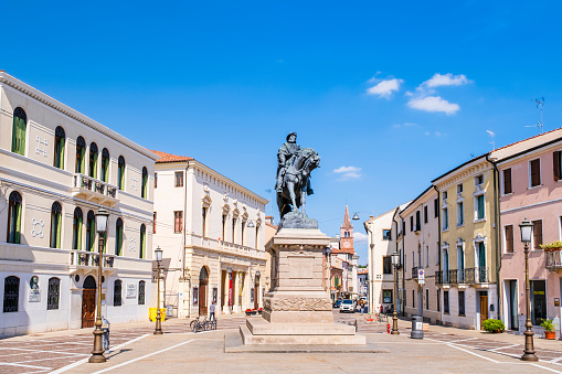 Giuseppe Garibaldi Square is one of the most important squares of Rovigo, a town in the Veneto region, northeast Italy. In the center stands the bronze monument dedicated to the Italian patriot Giuseppe Garibaldi, installed in 1896. People strolling.