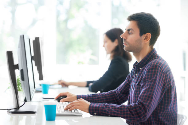 istock Two business people working in the office 1264446096