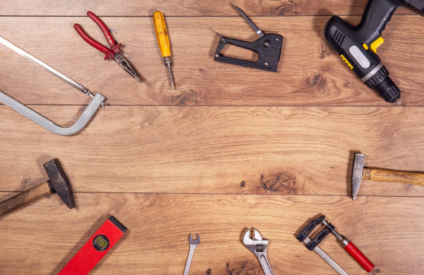 istock Tools on wooden table top view. Handicraft , engineering and handyman kit on wooden background seen from abowe. Copy space frame on wood. 1264447227