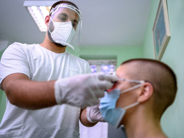 istock Woman having her eyes examined by optometrist. 1264447572
