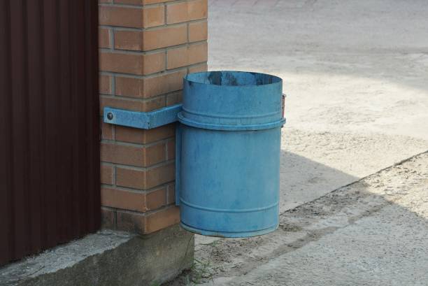 istock one blue iron urn hanging on a brown brick wall 1264447602