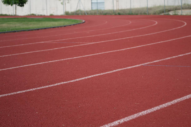 istock Curved foreground on athletic track, unfocused background. Sports concept 1264449891