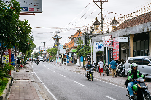 Busy traffic on one of the central streets of Canggu, where many shops, warungs and cafes are located.
