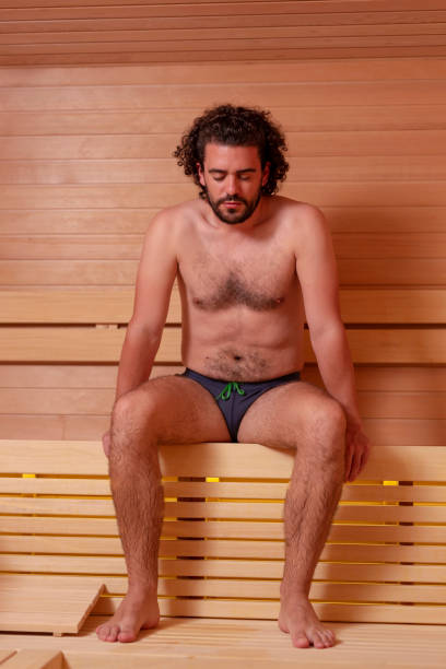 istock Man sitting in sauna 1264454223