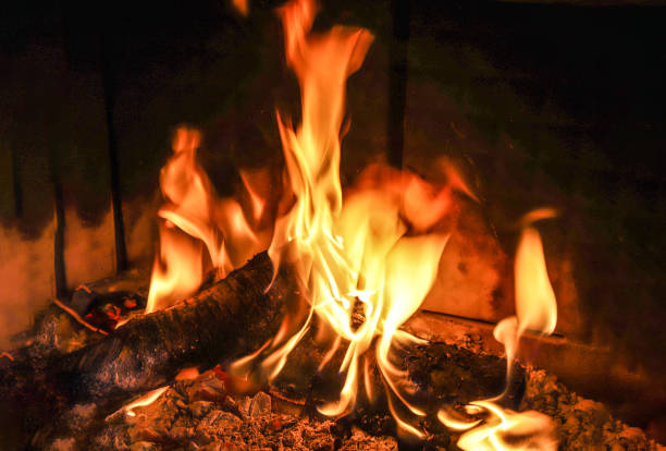 istock Beautiful red and orange hot burning fire in a fireplace 1264454368