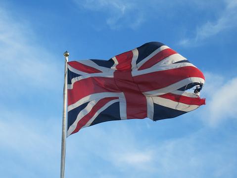 London, UK - April 6 2023: Union Jacks outside Buckingham Palace, which have been installed ahead of the coronation of King Charles III.