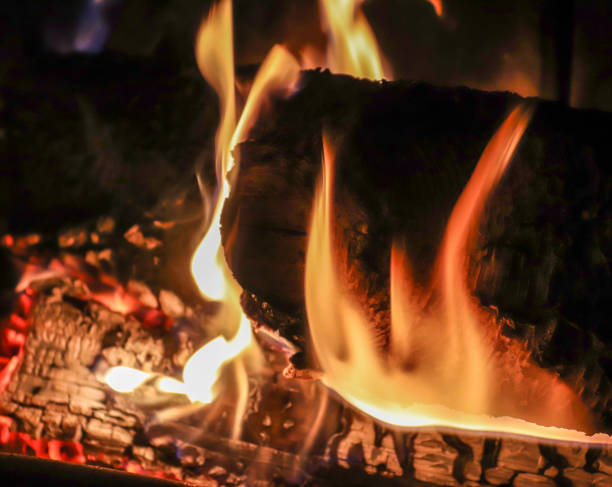 istock Beautiful red and orange hot burning fire in a fireplace 1264455389