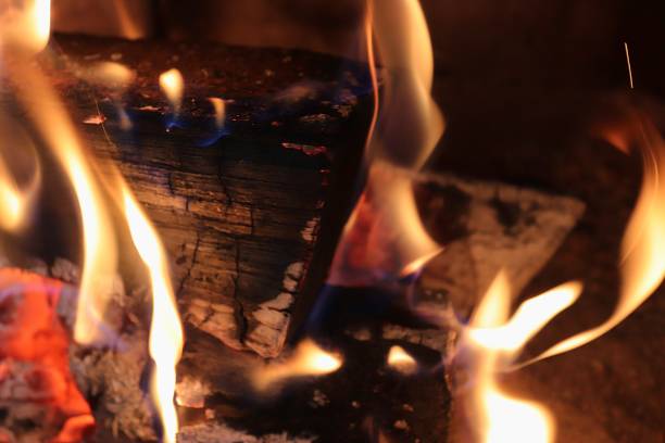 istock Beautiful red and orange hot burning fire in a fireplace 1264455416