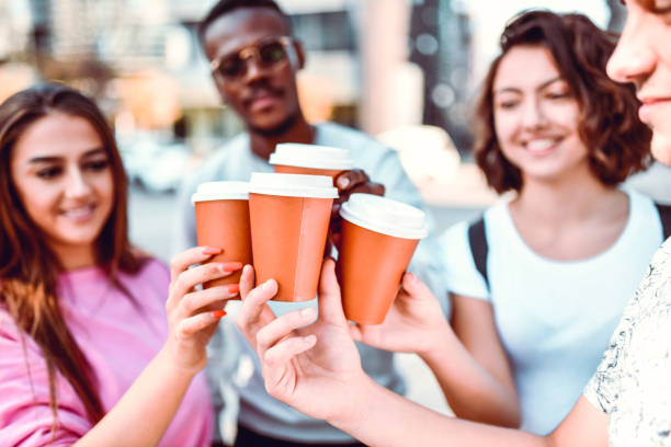 istock Coffee Celebratory Toast By Multiethnic Friends 1264456158