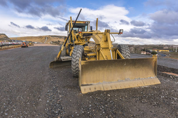istock Motor grader in the construction work of a road 1264457409