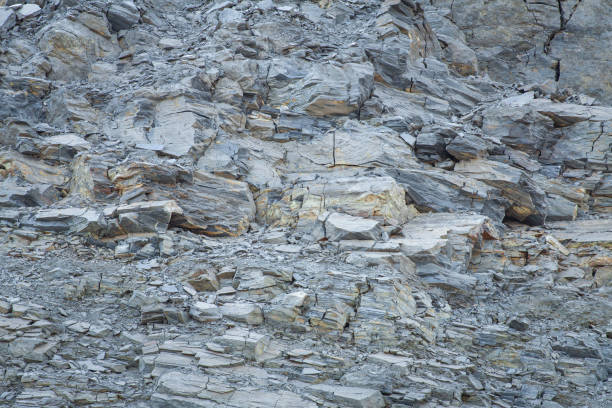 istock Gray rock with crumbling stones 1264458847