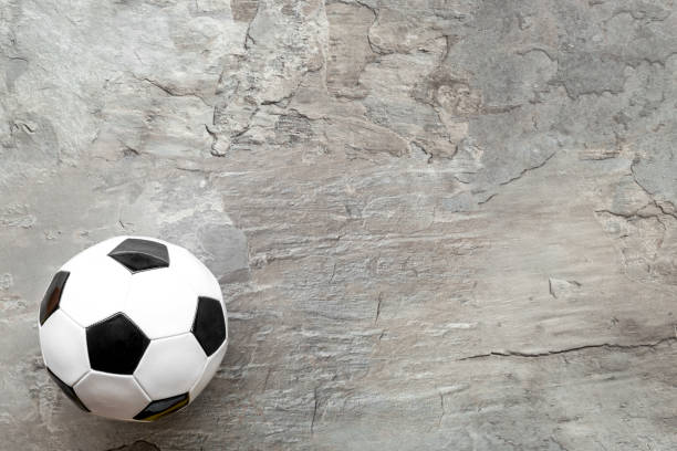 istock Football ball on grey background top view copy space 1264459761