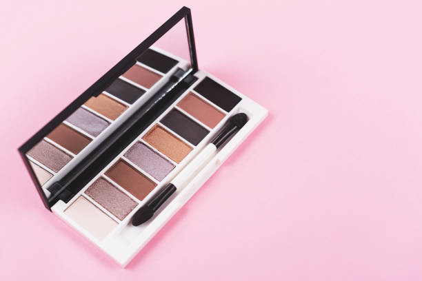 istock Eye shadow palette on pastel pink background. 1264462967