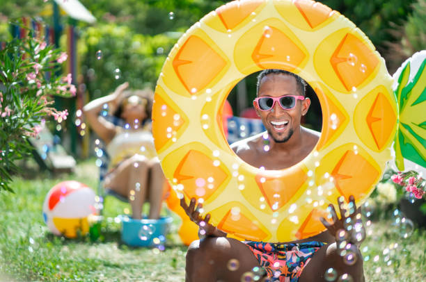 istock Afro Couple having staycation fun on back yard, during COVID-19 1264463225