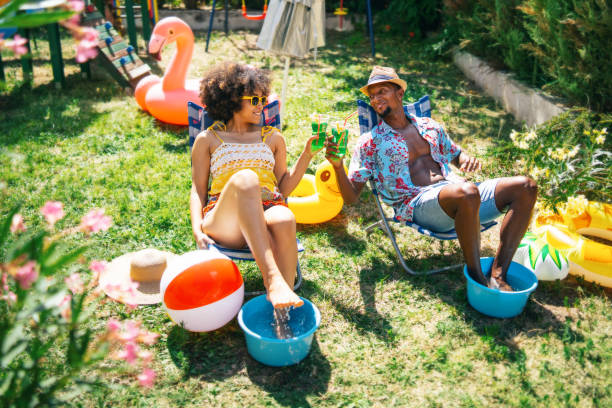 istock Couple having staycation fun on back yard and drinking cocktails, during COVID-19 1264463234