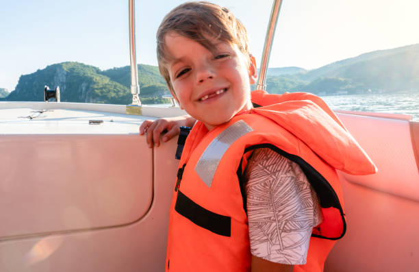 istock Little boy enjoying on the boat 1264463322