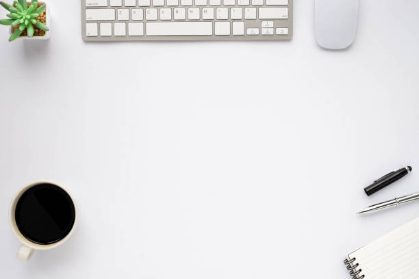 istock White office desk table with keyboard, notebook and coffee cup with equipment other office supplies. Business and finance concept. Workplace, Flat lay with blank copy space, top view. 1264465593