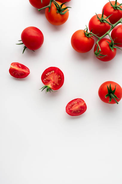 istock Ripe cherry tomatoes on white background. Flat lay. Summer food concept. 1264465600