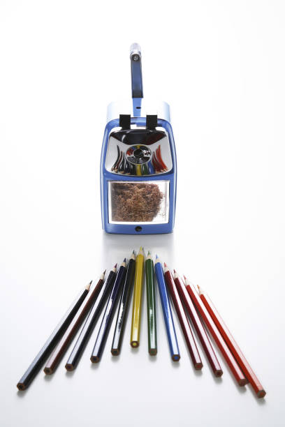 istock Color pencils arranged as an arrow pointing at sharpener 1264467419