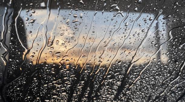 Trickle down Trickle down - water droplets trickling down the windscreen flushing water stock pictures, royalty-free photos & images