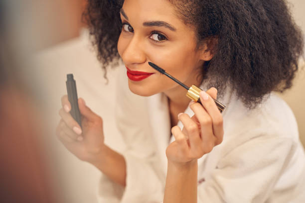 istock Appealing lady enjoying the process of self makeup 1264469379
